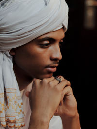 Close-up of young woman drinking water