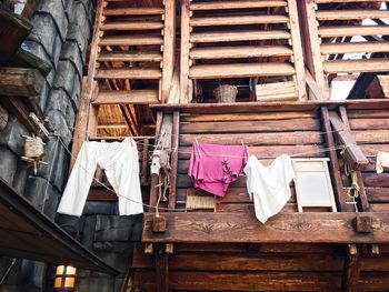 Low angle view of clothes drying against building