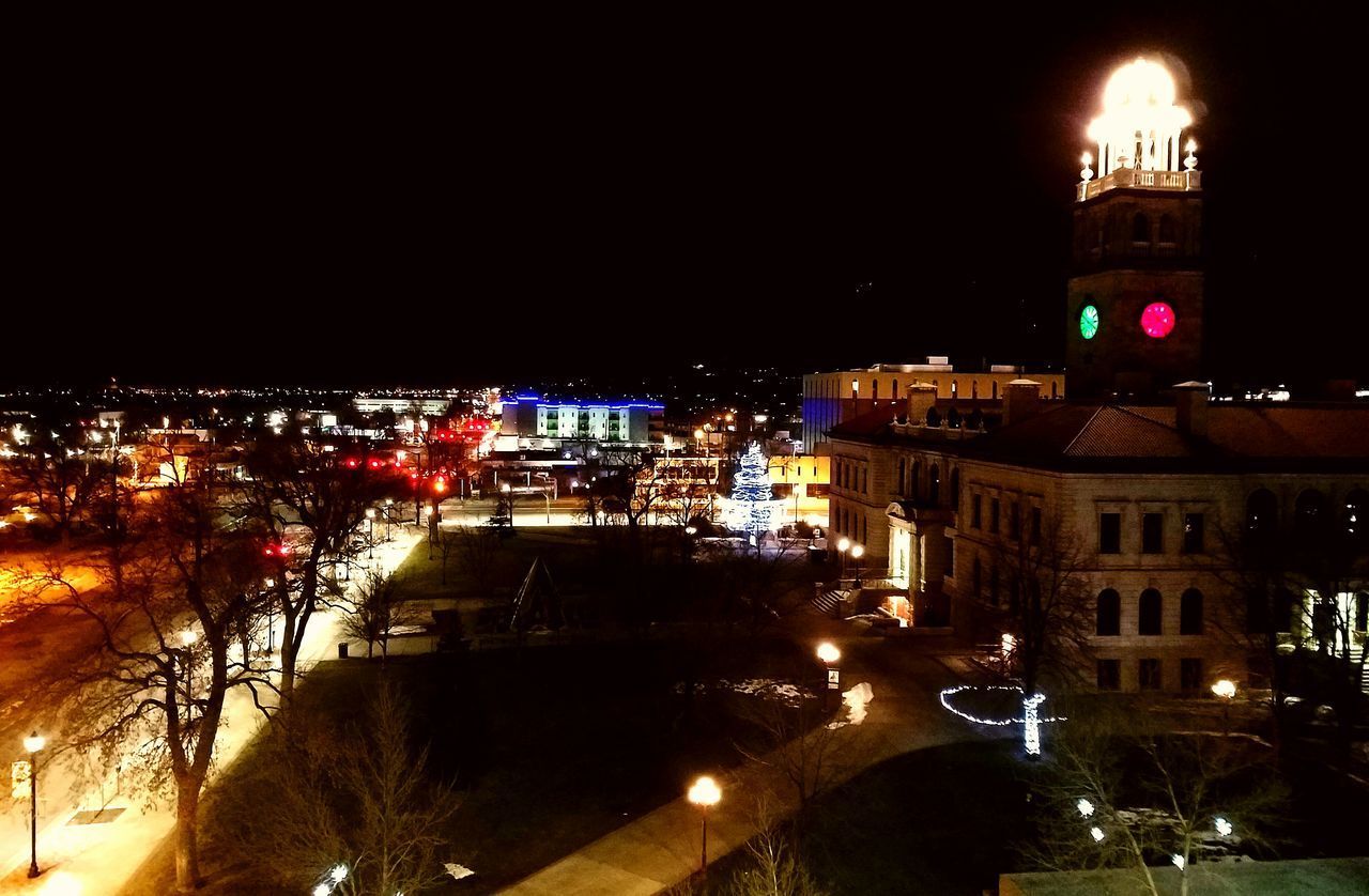 VIEW OF ILLUMINATED CITY AT NIGHT