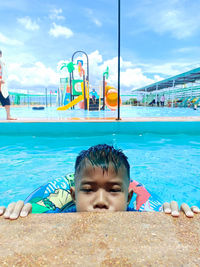 Portrait of boy in swimming pool