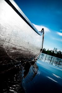 Close-up of sailboat on sea against sky