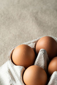 Close-up of eggs against white background