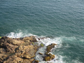 High angle view of rocks in sea