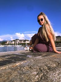 Woman wearing sunglasses against sky