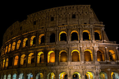 Low angle view of historical building at night