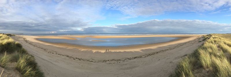 Panoramic view of desert against sky