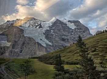 Scenic view of snowcapped mountains against sky