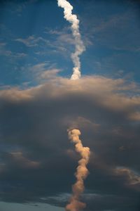 Low angle view of vapor trail at cape canaveral against sky