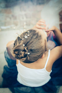 Rear view of girl with hair bun
