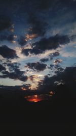 Silhouette of landscape against sky at sunset