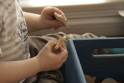 Close-up of hands of a child playing