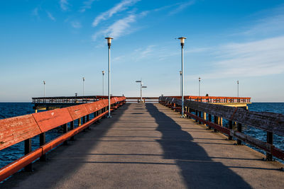 View of pier on sea against sky