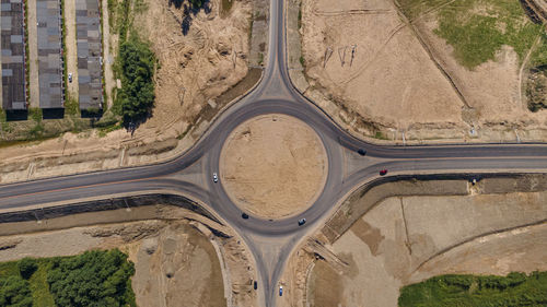 Top down aerial view of a new traffic roundabout. solving problem of jams. construction business.