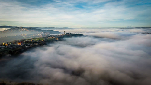 Aerial view of cityscape against sky