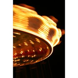 Close-up of illuminated carousel at night