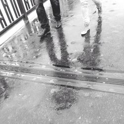 Low section of woman in puddle