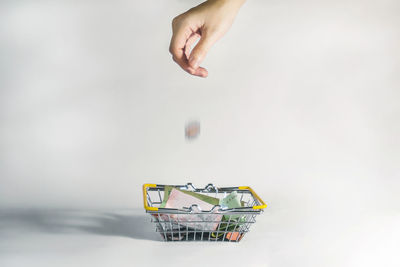Close-up of person hand against white background