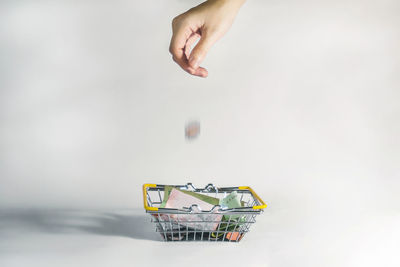 Close-up of person hand against white background