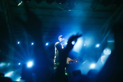 Low angle view of musician performing at nightclub