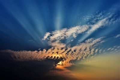 Low angle view of dramatic sky during sunset