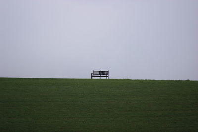 Built structure on field against clear sky