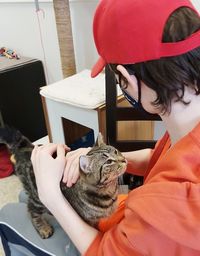 Midsection of woman with cat