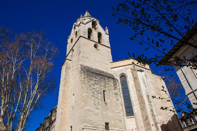 Low angle view of building against clear blue sky