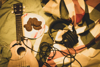 High angle view of guitar on table