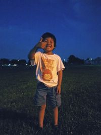 Full length of girl standing on field