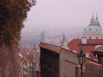 Buildings in city against clear sky