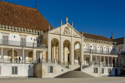 Facade of historic building against blue sky
