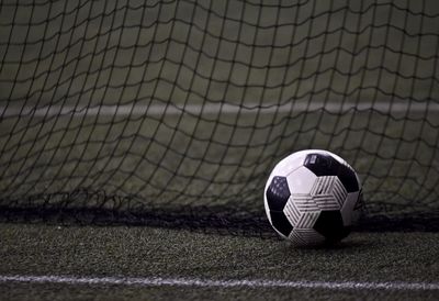 Close-up of ball on soccer field