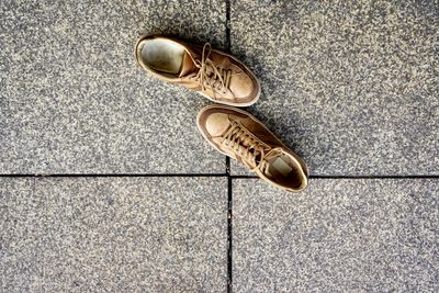 High angle view of shoes on tiled floor