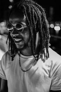 Smiling young man with dreadlocks