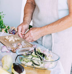 Midsection of man preparing food