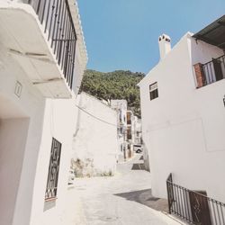 Buildings in city against clear sky