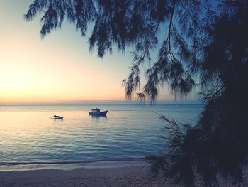 Scenic view of sea against sky at sunset