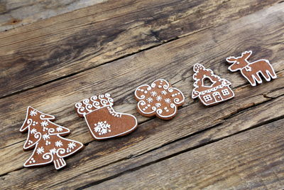 High view of christmas cookies on wooden table