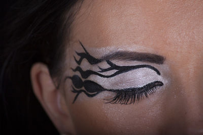 Close-up portrait of a young woman with eyes closed