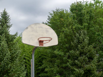 Low angle view of basketball hoop against sky