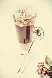 Close-up of coffee cup against white background