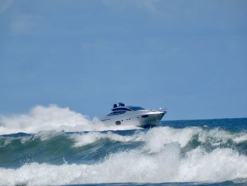 Boat in sea against sky