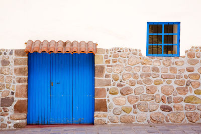 Closed blue door of building