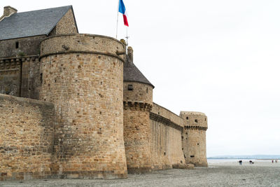 View of historical building against sky. walls of the mount saint michel 