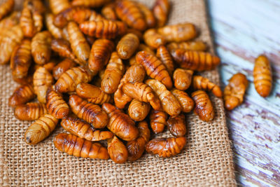 Close-up of roasted coffee beans on table