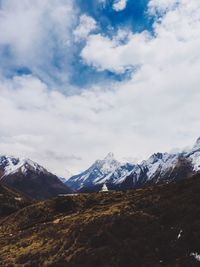 Scenic view of snowcapped mountains against sky