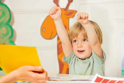 Portrait of boy playing with toy blocks