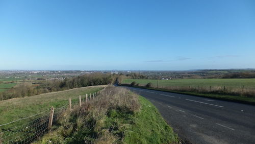 Road passing through field