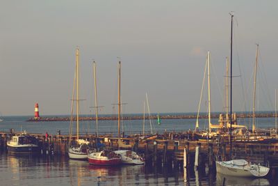 Boats moored at harbor