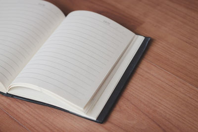 High angle view of open book on table